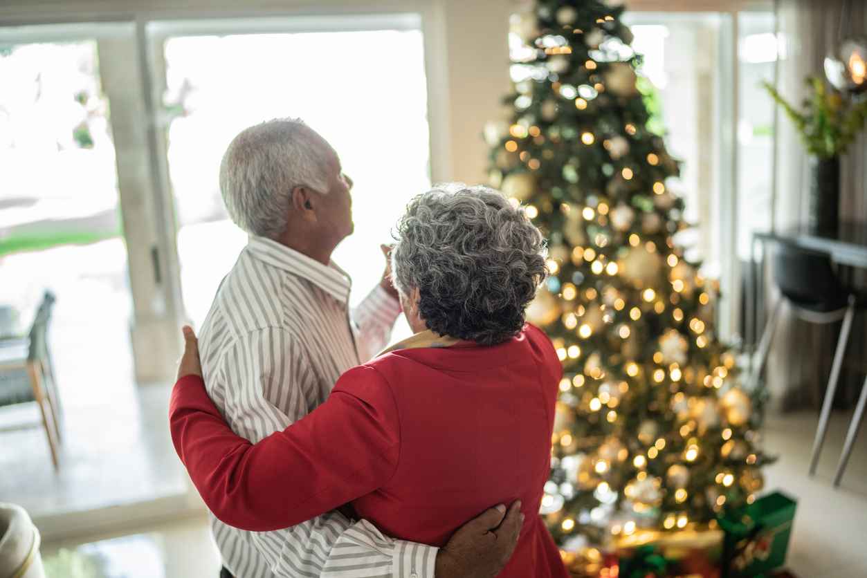 Senior couple dancing on christmas at home