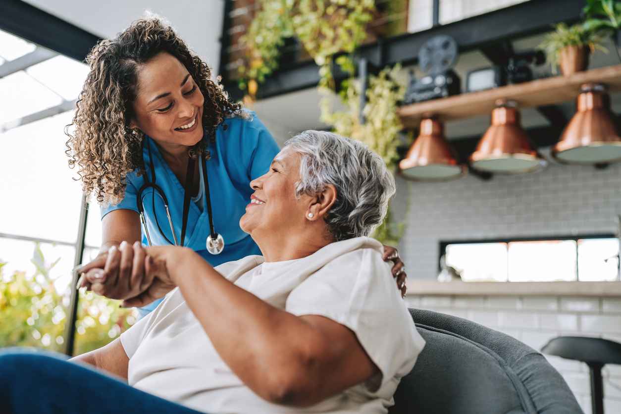 A home care nurse with her elderly patient